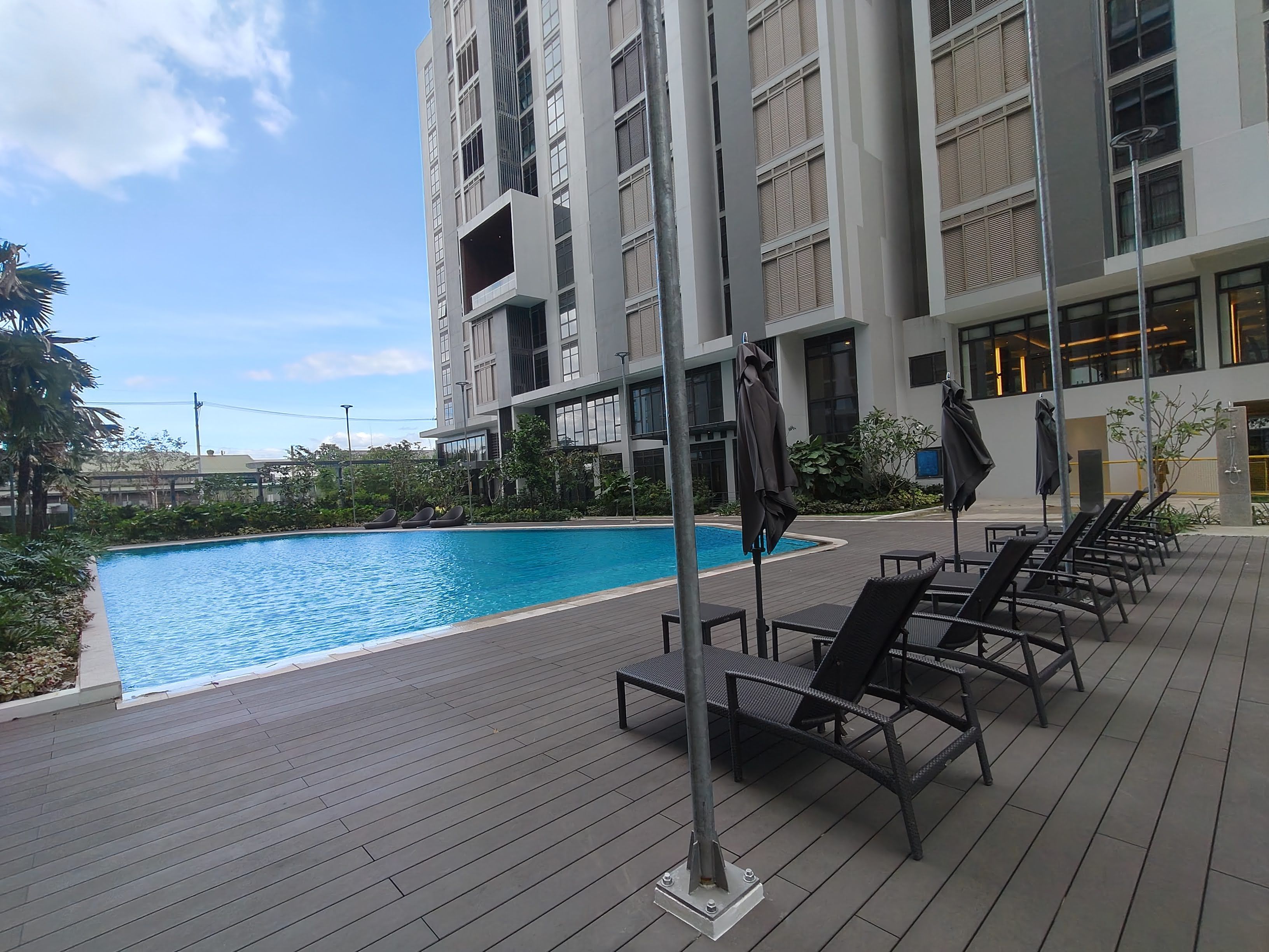 Deck chairs beside the pool of Arbor Lanes